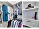 Well-organized walk-in closet with hanging racks and shelves at 16005 Cape Coral Dr, Wimauma, FL 33598