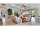 Open living room featuring a stone accent wall, comfortable seating, and a fireplace at 16005 Cape Coral Dr, Wimauma, FL 33598
