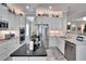 Island kitchen with white cabinets, granite countertops, and stainless steel appliances at 16005 Cape Coral Dr, Wimauma, FL 33598