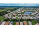 Aerial view of a lakefront community with numerous homes at 16005 Cape Coral Dr, Wimauma, FL 33598