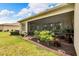 Backyard with screened patio and landscaping at 16005 Cape Coral Dr, Wimauma, FL 33598
