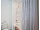 Clean bathroom with a tub, shower, and gray curtain at 8367 Ender Hills Dr, Wesley Chapel, FL 33545