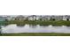 Lovely water view of a pond and houses at 8367 Ender Hills Dr, Wesley Chapel, FL 33545