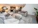 Open concept living room with view of kitchen and stairs at 8367 Ender Hills Dr, Wesley Chapel, FL 33545