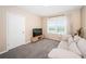 Comfortable bonus room featuring a sofa and TV at 8367 Ender Hills Dr, Wesley Chapel, FL 33545