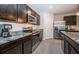 Modern kitchen with stainless steel appliances and granite countertops at 8367 Ender Hills Dr, Wesley Chapel, FL 33545