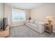 Bright bonus room with sofa, TV, and window at 8367 Ender Hills Dr, Wesley Chapel, FL 33545