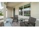 Covered porch with seating area and rug at 8367 Ender Hills Dr, Wesley Chapel, FL 33545