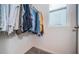 Organized closet with hanging clothes and window at 8367 Ender Hills Dr, Wesley Chapel, FL 33545