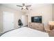 Bedroom with a bed, dresser, and large TV at 8367 Ender Hills Dr, Wesley Chapel, FL 33545