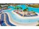 Relaxing lagoon beach with lounge chairs at 8367 Ender Hills Dr, Wesley Chapel, FL 33545