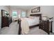Spacious primary bedroom with a king-size bed and walk-in closet at 8367 Ender Hills Dr, Wesley Chapel, FL 33545