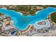 Aerial view of a crystal lagoon with beach and amenities at 8367 Ender Hills Dr, Wesley Chapel, FL 33545