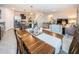 Open concept dining room flows into kitchen and living room at 8367 Ender Hills Dr, Wesley Chapel, FL 33545