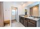 Double vanity bathroom with walk-in shower and closet at 8367 Ender Hills Dr, Wesley Chapel, FL 33545