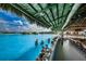Swim-up bar with seating, offering refreshing drinks at 8367 Ender Hills Dr, Wesley Chapel, FL 33545