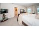 Main bedroom with king bed and ensuite access at 8367 Ender Hills Dr, Wesley Chapel, FL 33545