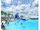 Lagoon with waterslide and many people at 8367 Ender Hills Dr, Wesley Chapel, FL 33545