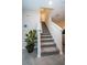 Modern staircase with gray carpeting and white railings at 8367 Ender Hills Dr, Wesley Chapel, FL 33545