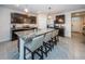 Modern kitchen with an island, granite countertops, and stainless steel appliances at 8367 Ender Hills Dr, Wesley Chapel, FL 33545