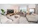 Relaxing living room featuring neutral tones and ample natural light at 8367 Ender Hills Dr, Wesley Chapel, FL 33545