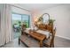 Bright dining room with wooden table and access to backyard patio at 8367 Ender Hills Dr, Wesley Chapel, FL 33545