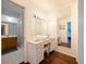 Bathroom with vanity, large mirror, and separate shower at 8212 Forest Cir, Seminole, FL 33776