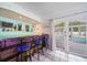 Bar with seating and view of the pool and lanai at 8212 Forest Cir, Seminole, FL 33776