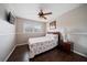 Bedroom with queen bed, hardwood floors and ceiling fan at 8212 Forest Cir, Seminole, FL 33776