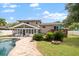 House with large backyard, pool, deck, and screened porch at 8212 Forest Cir, Seminole, FL 33776