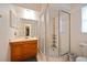 Clean bathroom with shower, toilet and wooden vanity at 8212 Forest Cir, Seminole, FL 33776