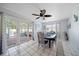 Dining room with table and chairs, view to screened porch and pool at 8212 Forest Cir, Seminole, FL 33776