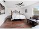Spacious bedroom with hardwood floors and ceiling fan at 8212 Forest Cir, Seminole, FL 33776