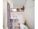 Small bathroom with pedestal sink, toilet and shower at 8212 Forest Cir, Seminole, FL 33776