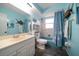 Bathroom with shower/tub combo, vanity, and beach theme at 8212 Forest Cir, Seminole, FL 33776