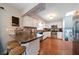 Kitchen with white cabinets, stainless steel appliances, and mosaic backsplash at 8212 Forest Cir, Seminole, FL 33776