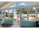 Screened porch with view of the pool and backyard at 8212 Forest Cir, Seminole, FL 33776