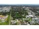 Birds eye view of the home and surrounding tree-lined neighborhood, near local services and homes at 733 1/2 New Jersey St, Clearwater, FL 33756