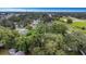 Mature trees provide privacy in this aerial view of the backyard and lot at 733 1/2 New Jersey St, Clearwater, FL 33756