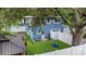 Aerial view of backyard showing swing, gazebo, playset, and lush synthetic grass at 733 1/2 New Jersey St, Clearwater, FL 33756