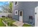 Backyard view featuring artificial turf, play set, and back door at 733 1/2 New Jersey St, Clearwater, FL 33756