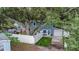 Two-story home featuring a fenced backyard with a gazebo, play set, and tree swing at 733 1/2 New Jersey St, Clearwater, FL 33756