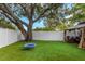 Expansive backyard with artificial turf, swing, and gazebo at 733 1/2 New Jersey St, Clearwater, FL 33756