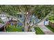 Large tree in backyard overlooking a gazebo, playset, and tree swing at 733 1/2 New Jersey St, Clearwater, FL 33756