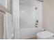 Bright bathroom showcasing a pristine shower over tub, and contemporary toilet at 733 1/2 New Jersey St, Clearwater, FL 33756