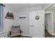 Bedroom with wall art and decor and access to additional rooms via interior door at 733 1/2 New Jersey St, Clearwater, FL 33756