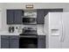 Modern kitchen with stainless steel appliances, stylish cabinets and marble countertops. Great for cooking at 733 1/2 New Jersey St, Clearwater, FL 33756