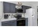 Modern kitchen with stainless steel appliances, stylish cabinets and marble countertops. Great for cooking at 733 1/2 New Jersey St, Clearwater, FL 33756