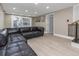 Spacious living room with a modern sectional couch and plenty of natural light at 733 1/2 New Jersey St, Clearwater, FL 33756