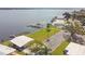 Aerial view of waterfront property with boat slips and large yard at 263 Lake Tarpon Dr # 18, Palm Harbor, FL 34684